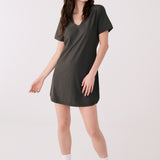 Lolë Olivie V-neck t-shirt dress in olive, front view on model — short sleeves and curved hem