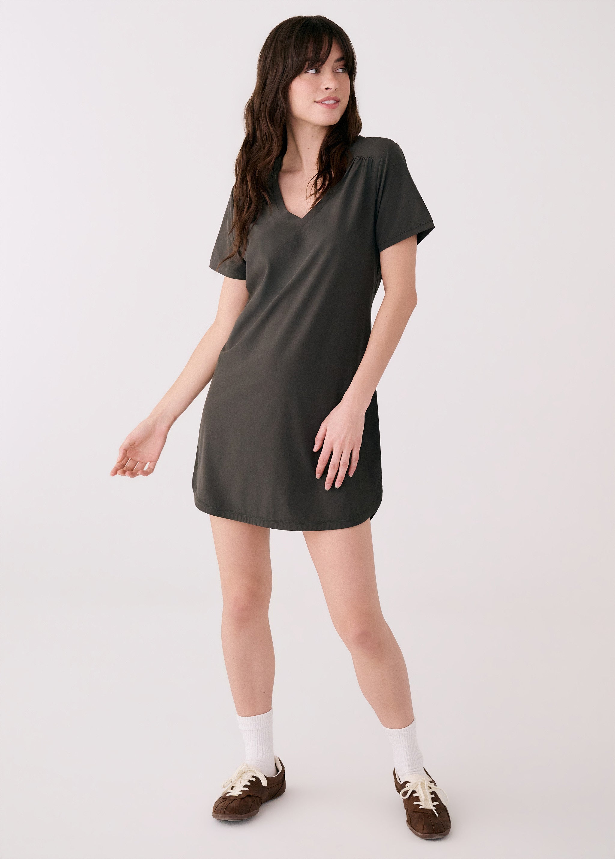 Lolë Olivie V-neck t-shirt dress in olive, front view on model — short sleeves and curved hem