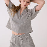 Lolë Bella Shorts in black stripe — a relaxed cotton short that balances comfort with a polished attitude