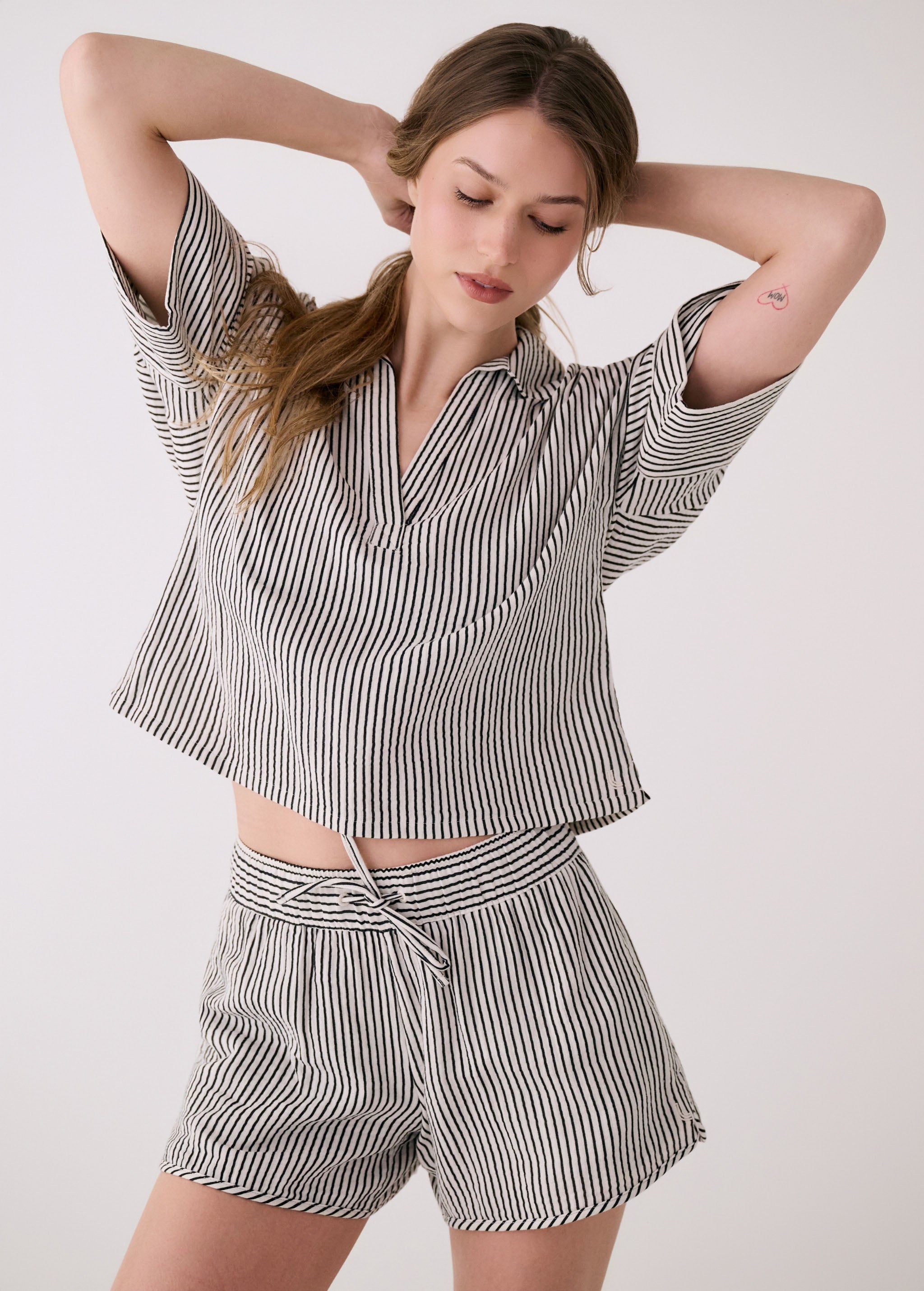 Lolë Bella Shorts in black stripe — a relaxed cotton short that balances comfort with a polished attitude