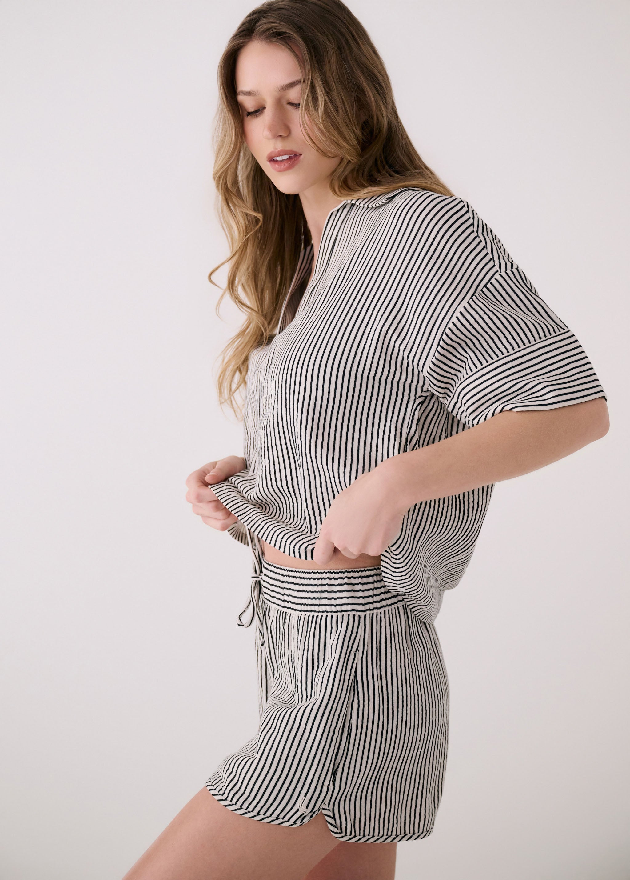 Lolë Bella Shorts in black stripe — a relaxed cotton short that balances comfort with a polished attitude
