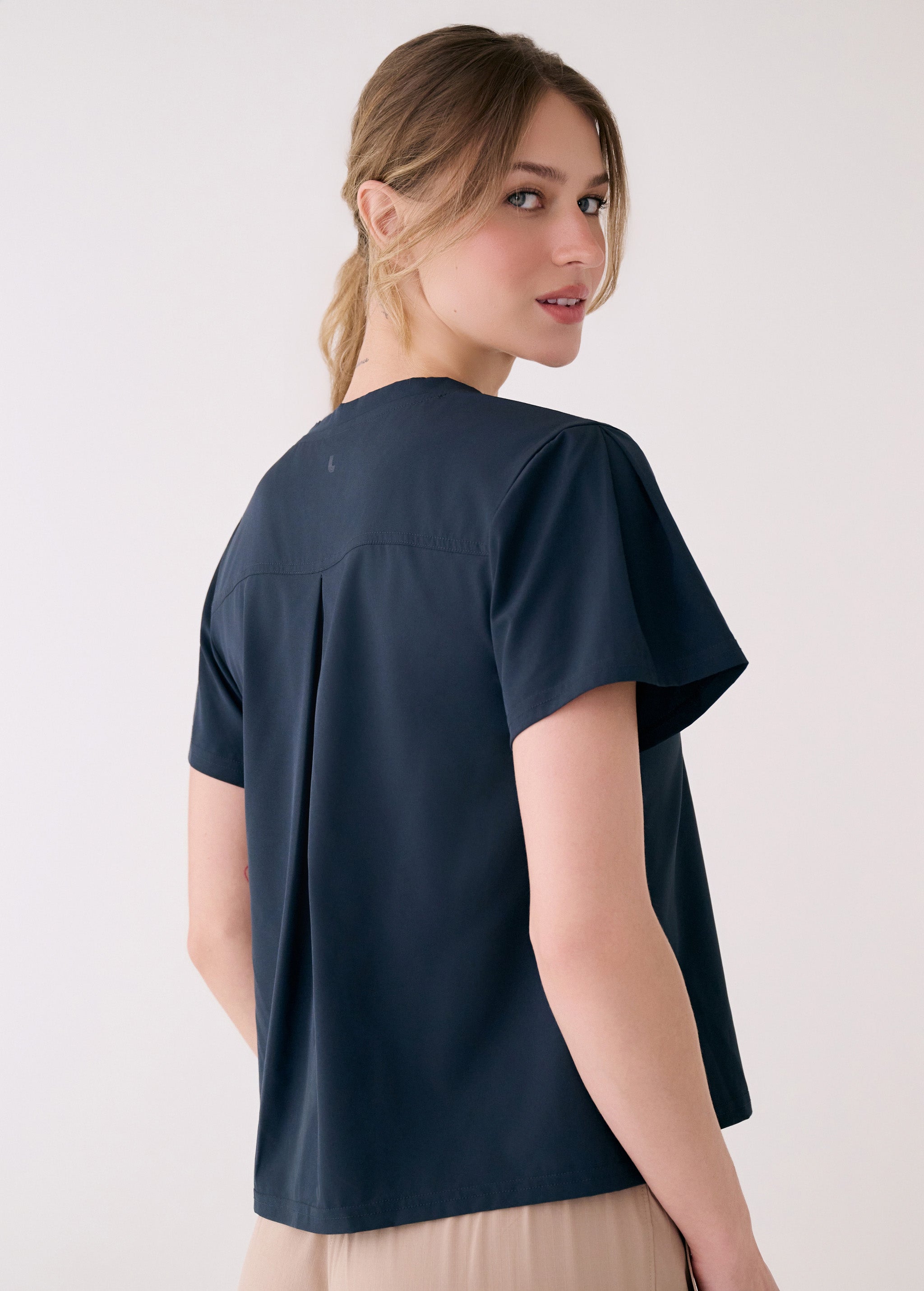 Lolë Olivie V-neck in Outerspace navy — your go-to V-neck with a little extra ease built in
