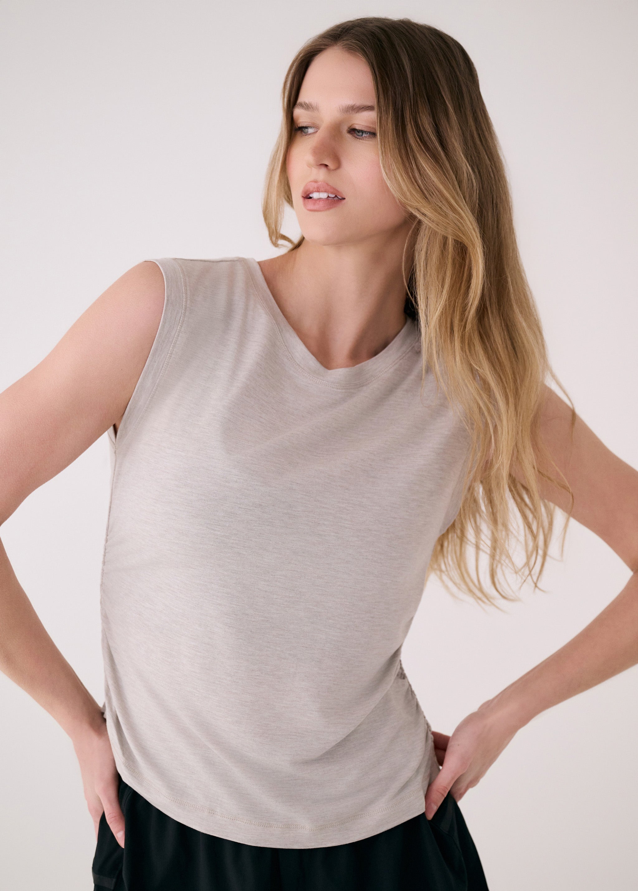 Lolë Elisia Short Sleeve in light grey — a short sleeve with a little extra built in