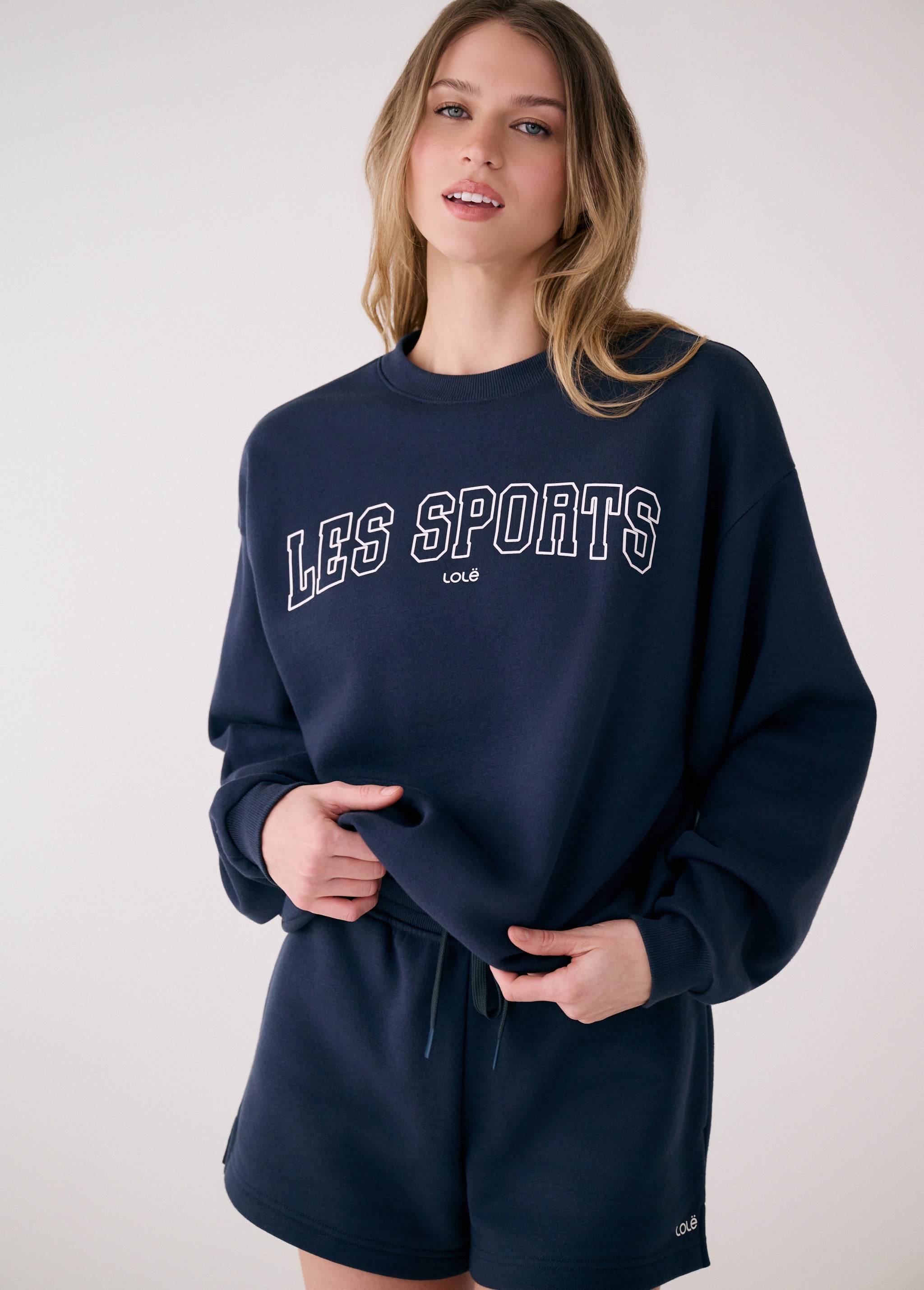 Lolë College Crew Neck Pullover in Outerspace navy — the College Crewneck pairs a relaxed fit with a soft, cozy feel
