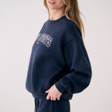 Lolë College Crew Neck Pullover in Outerspace navy — the College Crewneck pairs a relaxed fit with a soft, cozy feel