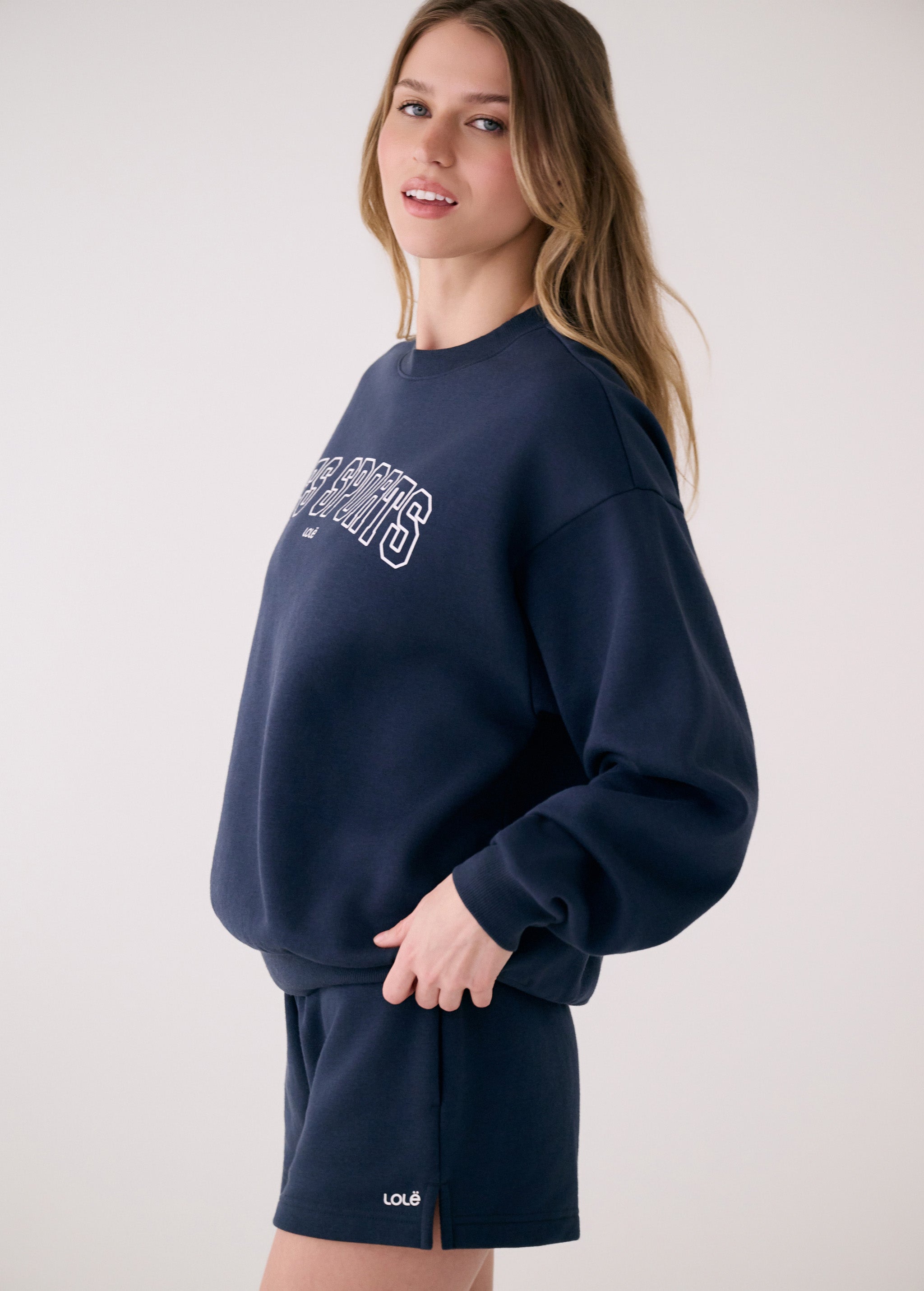 Lolë College Crew Neck Pullover in Outerspace navy — the College Crewneck pairs a relaxed fit with a soft, cozy feel