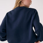 Lolë College Crew Neck Pullover in Outerspace navy — the College Crewneck pairs a relaxed fit with a soft, cozy feel