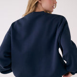 Lolë College Crew Neck Pullover in Outerspace navy — the College Crewneck pairs a relaxed fit with a soft, cozy feel
