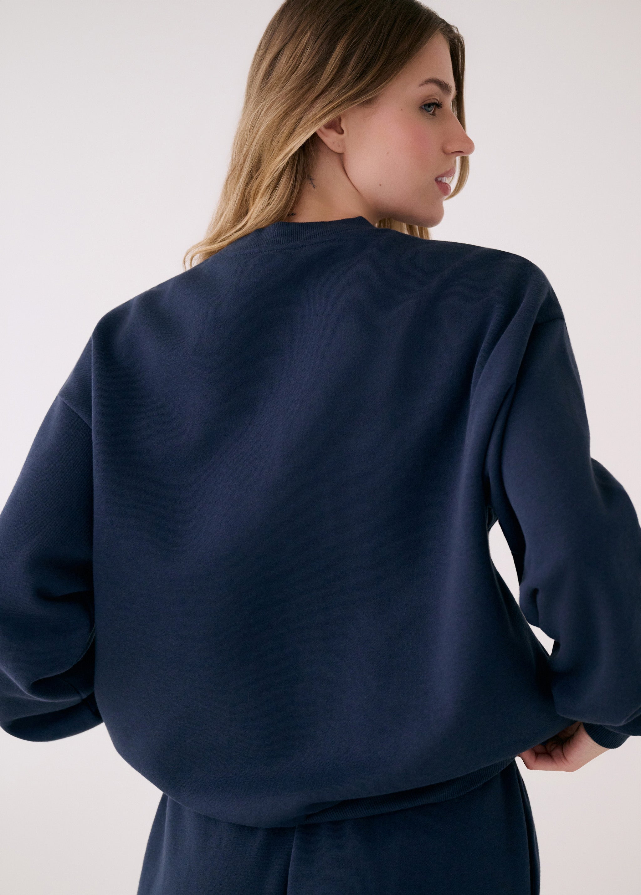 Lolë College Crew Neck Pullover in Outerspace navy — the College Crewneck pairs a relaxed fit with a soft, cozy feel