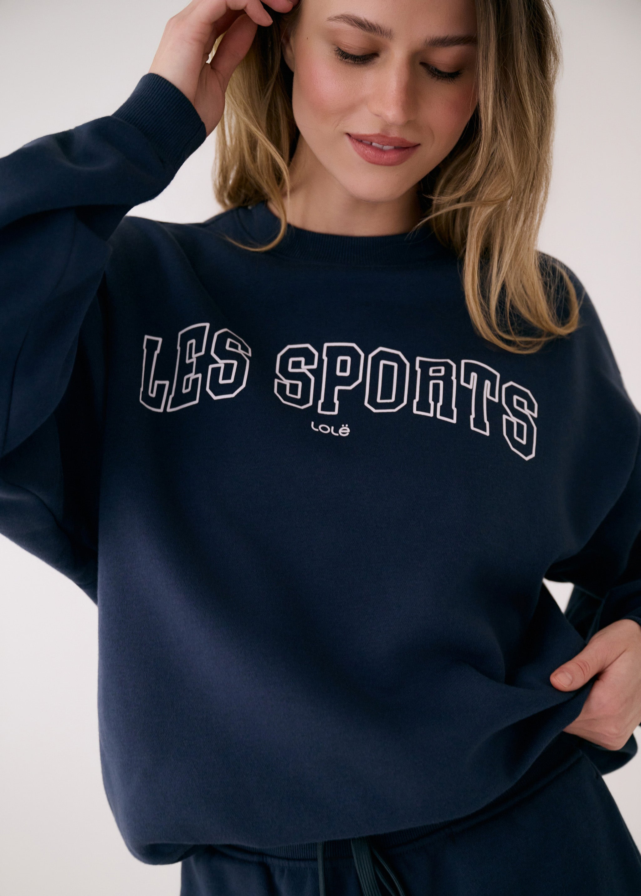 Lolë College Crew Neck Pullover in Outerspace navy — the College Crewneck pairs a relaxed fit with a soft, cozy feel
