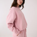 Lolë College Crew Neck Pullover in Ballerina blush pink — the College Crewneck pairs a relaxed fit with a soft, cozy feel