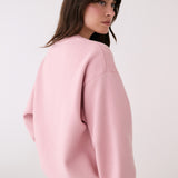 Lolë College Crew Neck Pullover in Ballerina blush pink — the College Crewneck pairs a relaxed fit with a soft, cozy feel