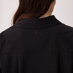 Lolë Momentum Shirt Dress in black — a polished shirt dress with a Lolë twist