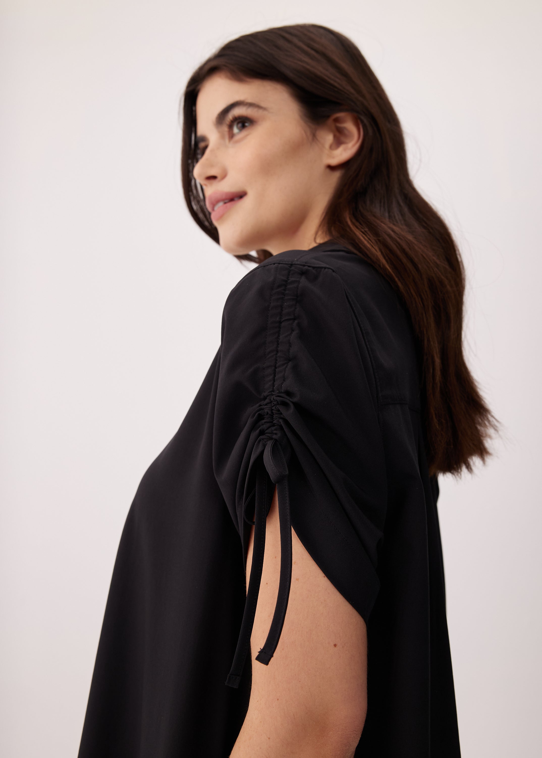 Lolë Momentum Shirt Dress in black — a polished shirt dress with a Lolë twist