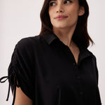 Lolë Momentum Shirt Dress in black — a polished shirt dress with a Lolë twist