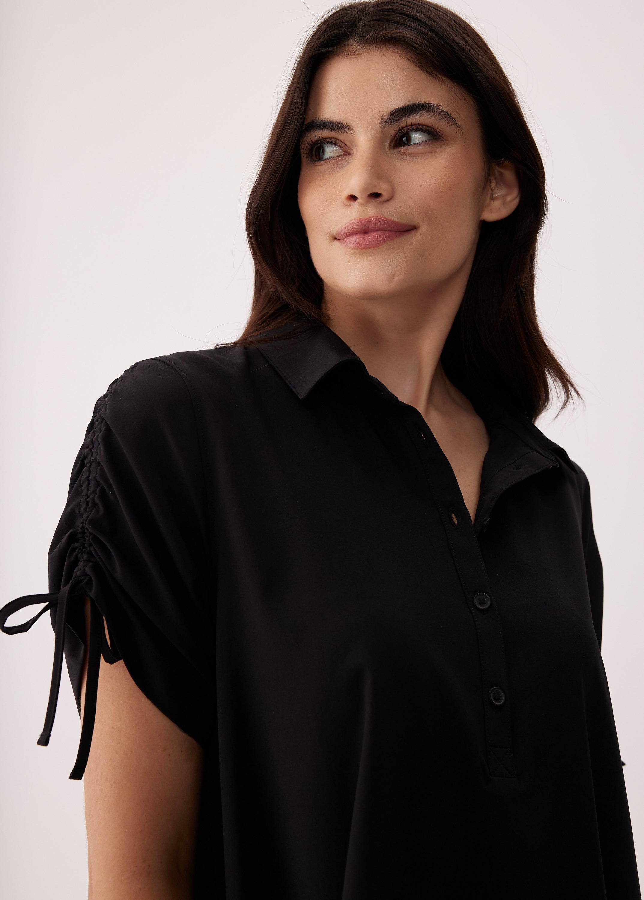Lolë Momentum Shirt Dress in black — a polished shirt dress with a Lolë twist