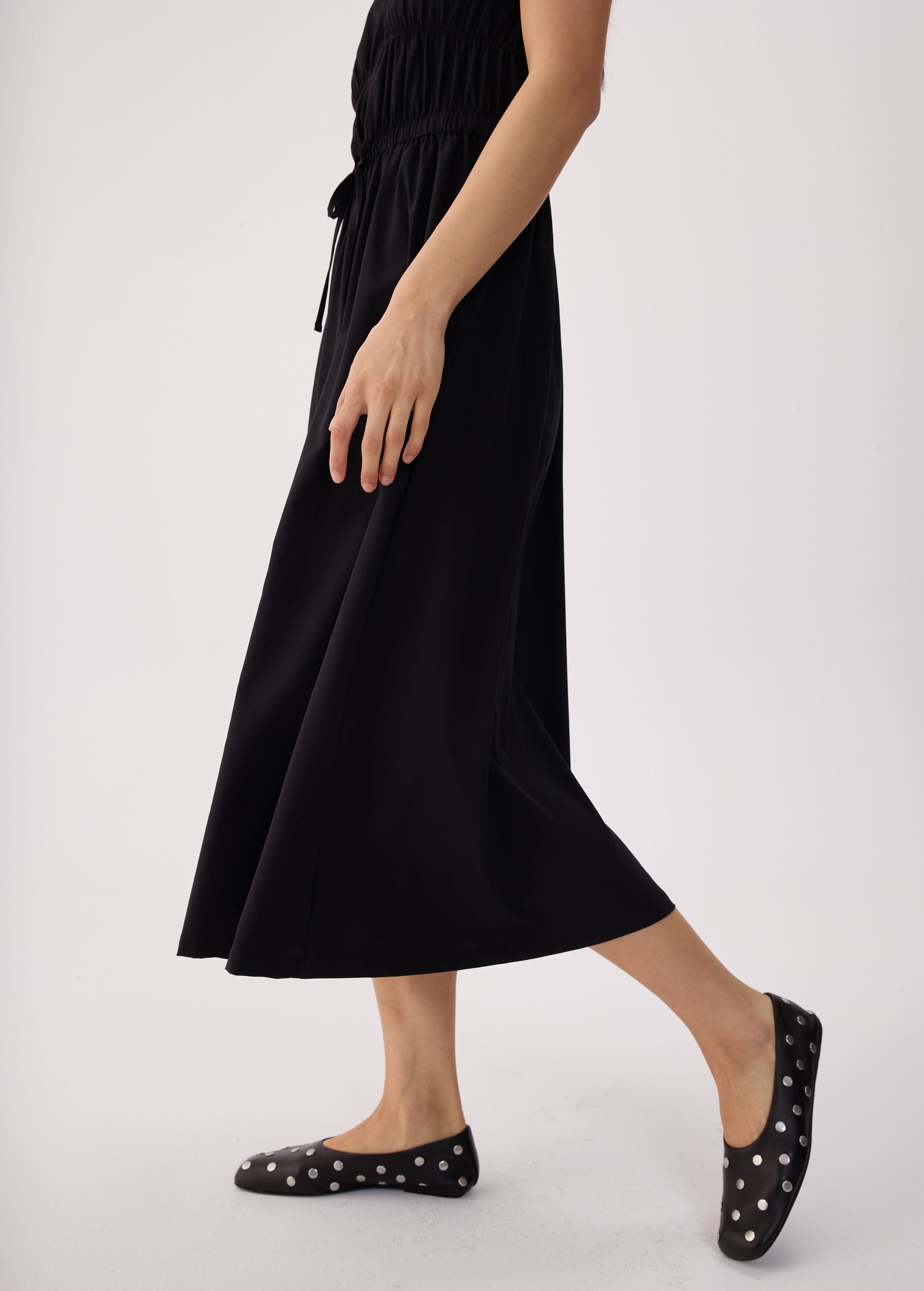 Lolë Momentum Ruched Midi Dress in black — the dress that gets you out the door faster than your morning coffee