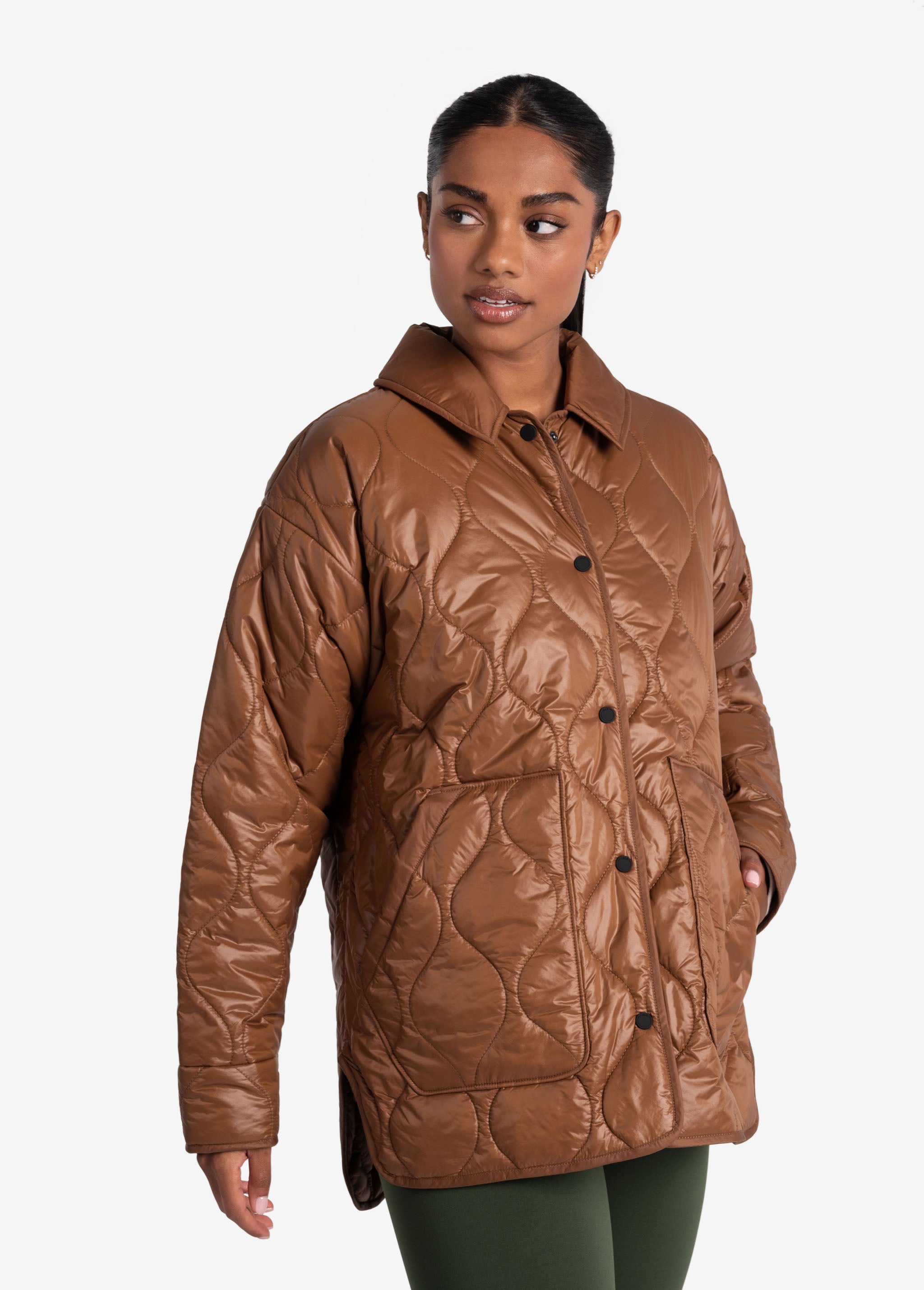 Lolë The Shacket Insulated Jacket in black — part shirt, part jacket, the Shacket is made for transitional days