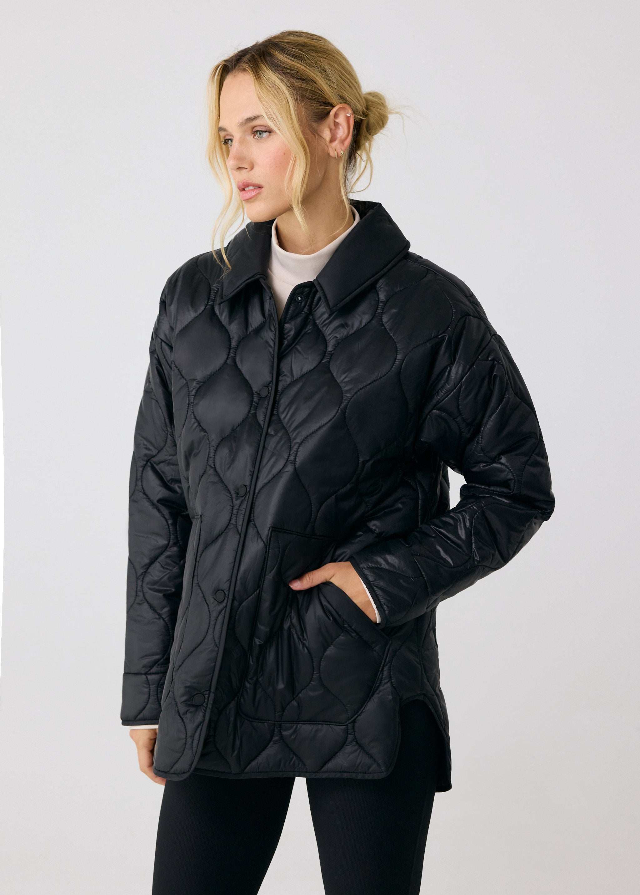 Lolë The Shacket Insulated Jacket in black — part shirt, part jacket, the Shacket is made for transitional days
