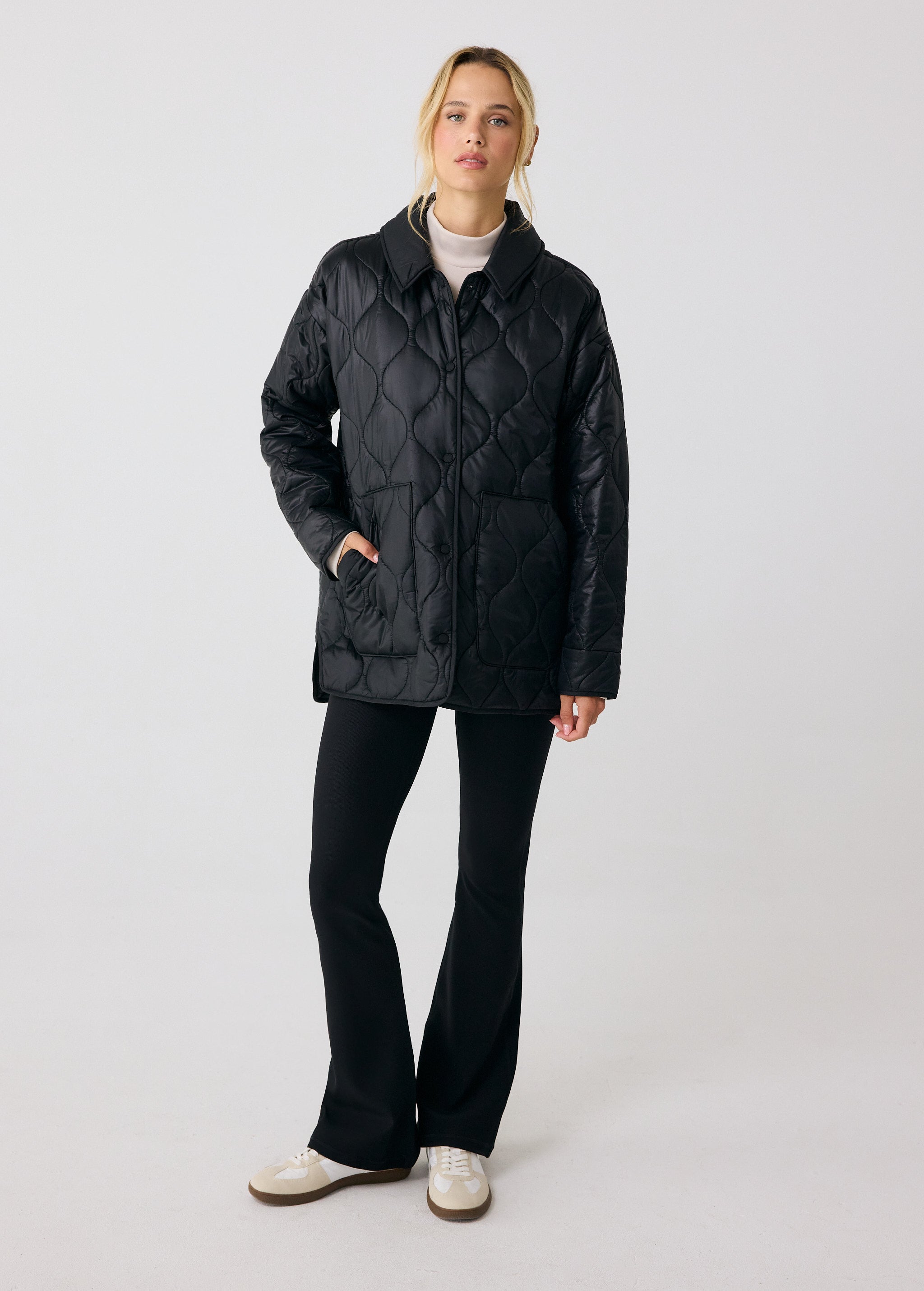 Lolë The Shacket Insulated Jacket in black — part shirt, part jacket, the Shacket is made for transitional days