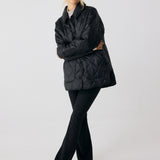 Lolë The Shacket Insulated Jacket in black — part shirt, part jacket, the Shacket is made for transitional days