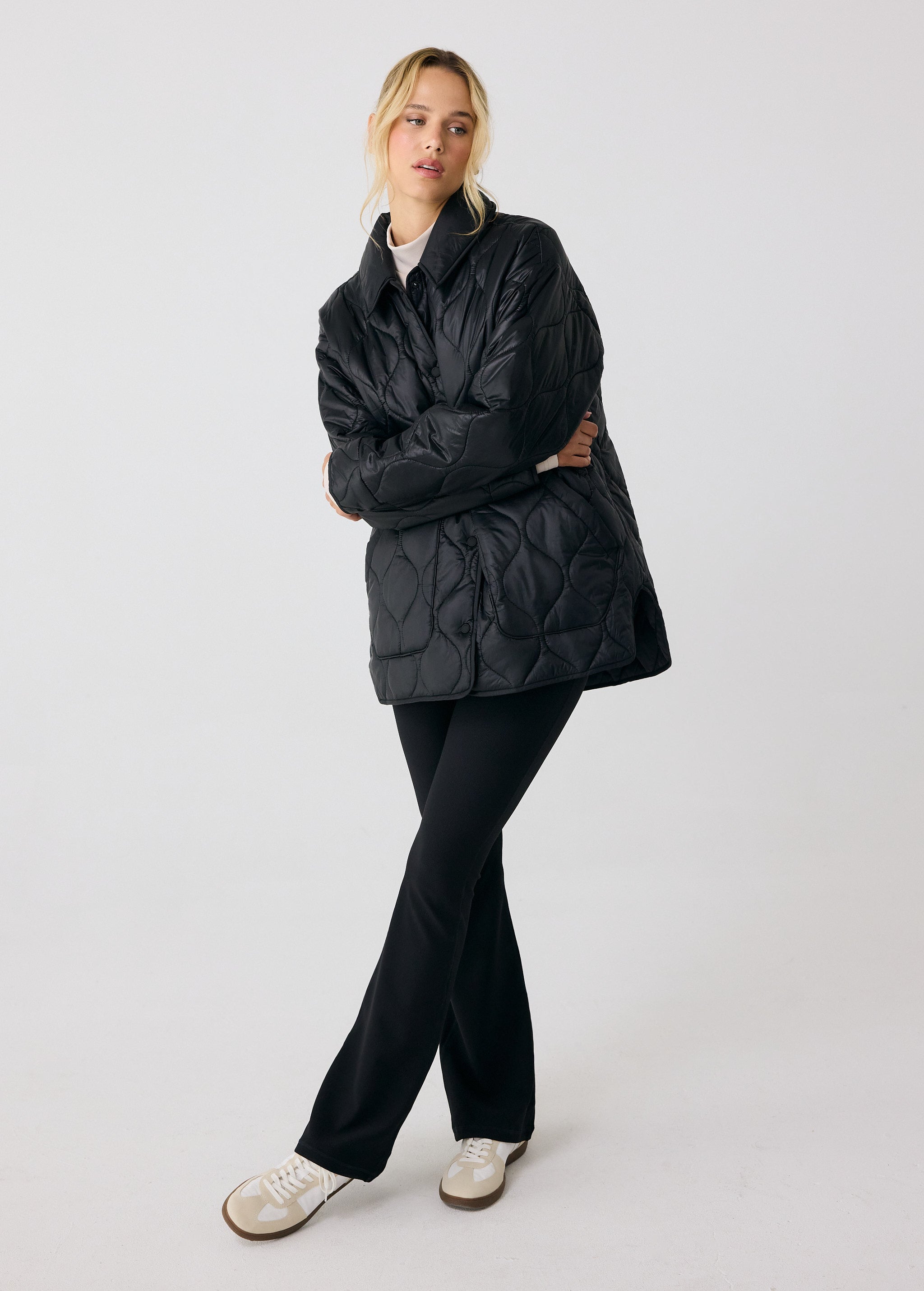 Lolë The Shacket Insulated Jacket in black — part shirt, part jacket, the Shacket is made for transitional days