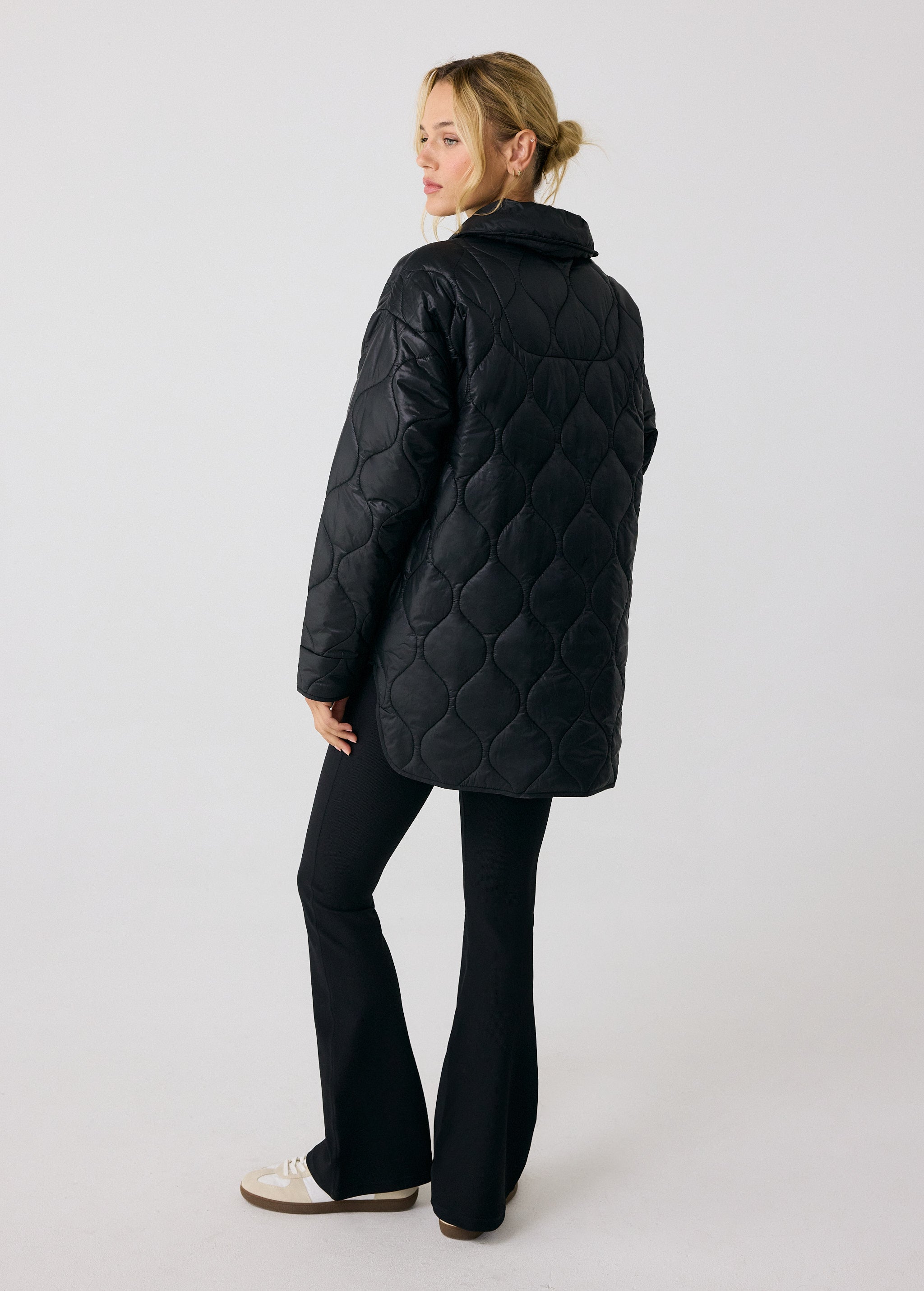 Lolë The Shacket Insulated Jacket in black — part shirt, part jacket, the Shacket is made for transitional days