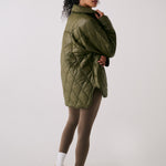 Lolë The Shacket Insulated Jacket in Moss olive green — part shirt, part jacket, the Shacket is made for transitional days