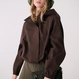 Lolë Alizé Rain Jacket in Java dark brown — fit note: Designed with a relaxed, oversized fit