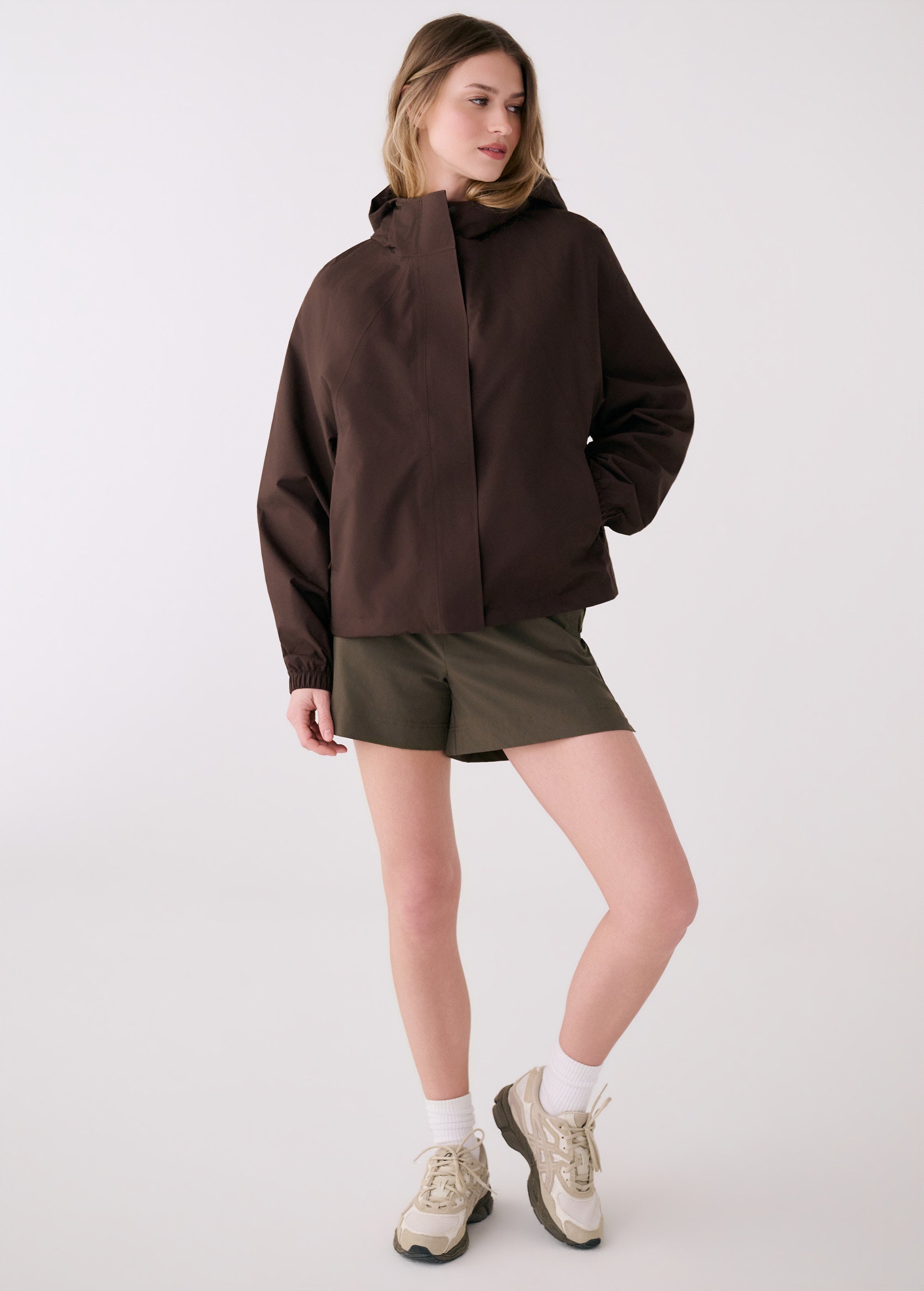 Lolë Alizé Rain Jacket in Java dark brown — fit note: Designed with a relaxed, oversized fit