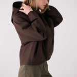 Lolë Alizé Rain Jacket in Java dark brown — fit note: Designed with a relaxed, oversized fit