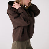 Lolë Alizé Rain Jacket in Java dark brown — fit note: Designed with a relaxed, oversized fit