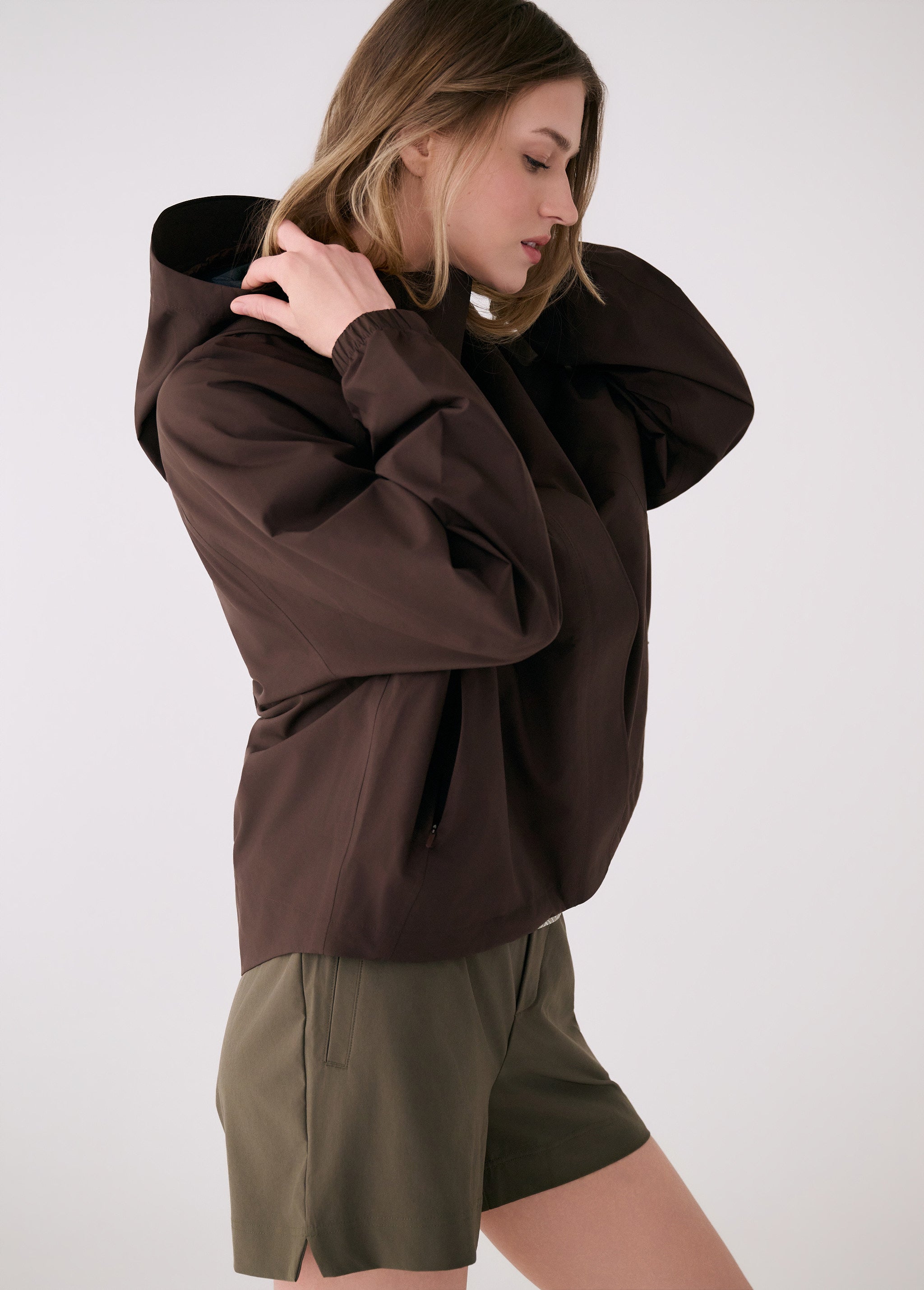 Lolë Alizé Rain Jacket in Java dark brown — fit note: Designed with a relaxed, oversized fit