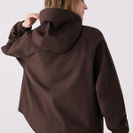 Lolë Alizé Rain Jacket in Java dark brown — fit note: Designed with a relaxed, oversized fit