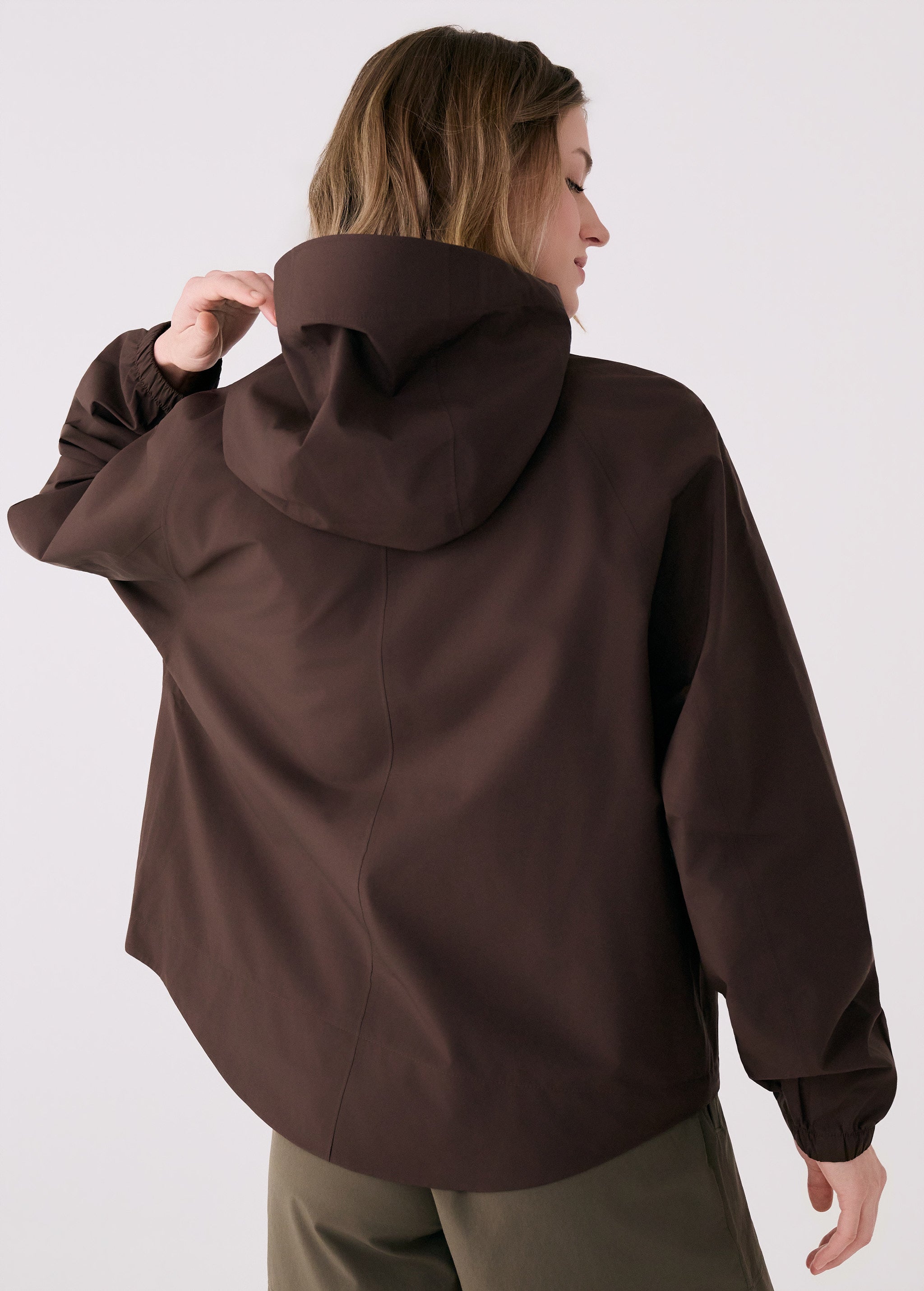 Lolë Alizé Rain Jacket in Java dark brown — fit note: Designed with a relaxed, oversized fit