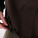 Lolë Alizé Rain Jacket in Java dark brown — fit note: Designed with a relaxed, oversized fit
