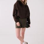 Lolë Alizé Rain Jacket in Java dark brown — fit note: Designed with a relaxed, oversized fit