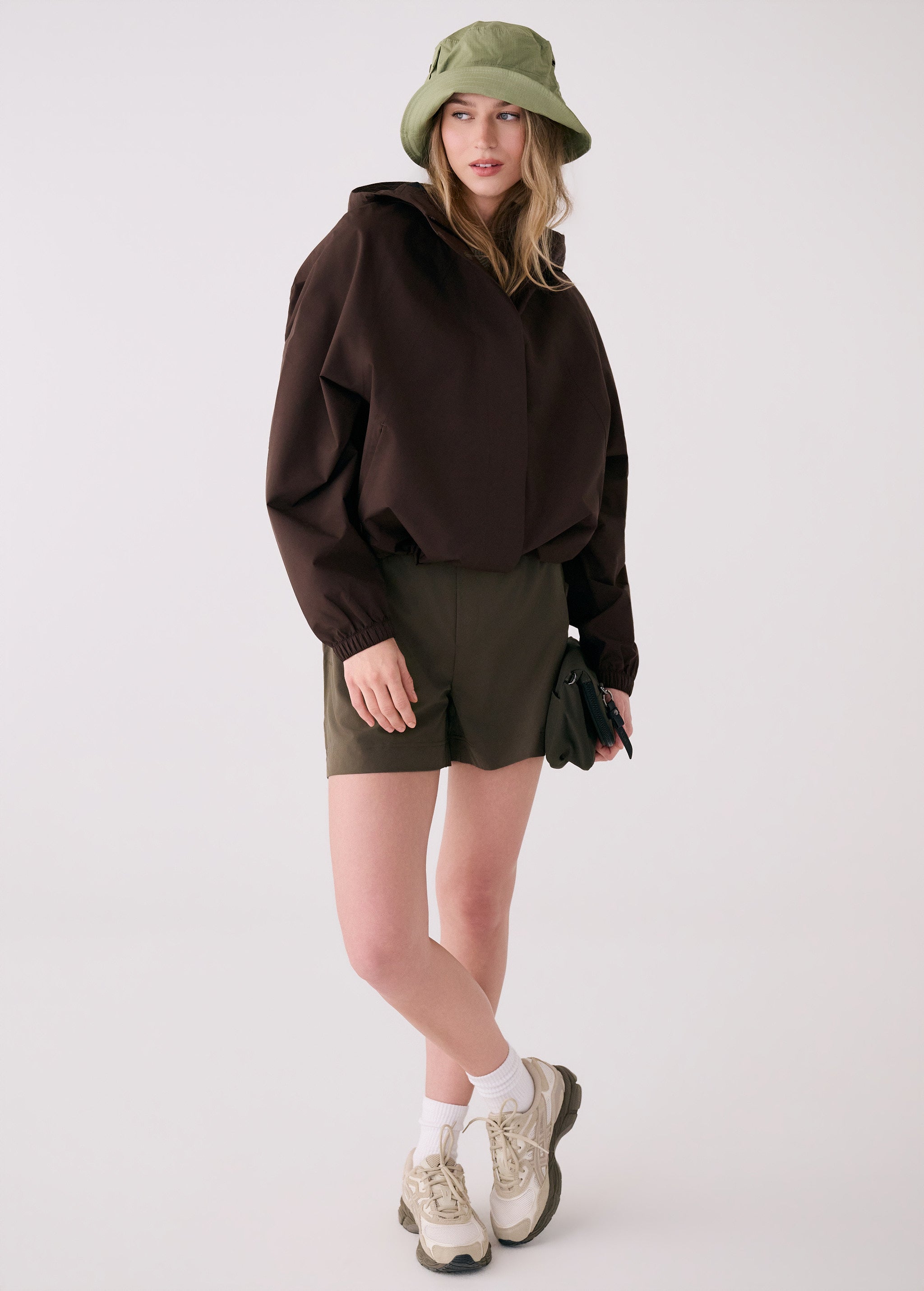 Lolë Alizé Rain Jacket in Java dark brown — fit note: Designed with a relaxed, oversized fit
