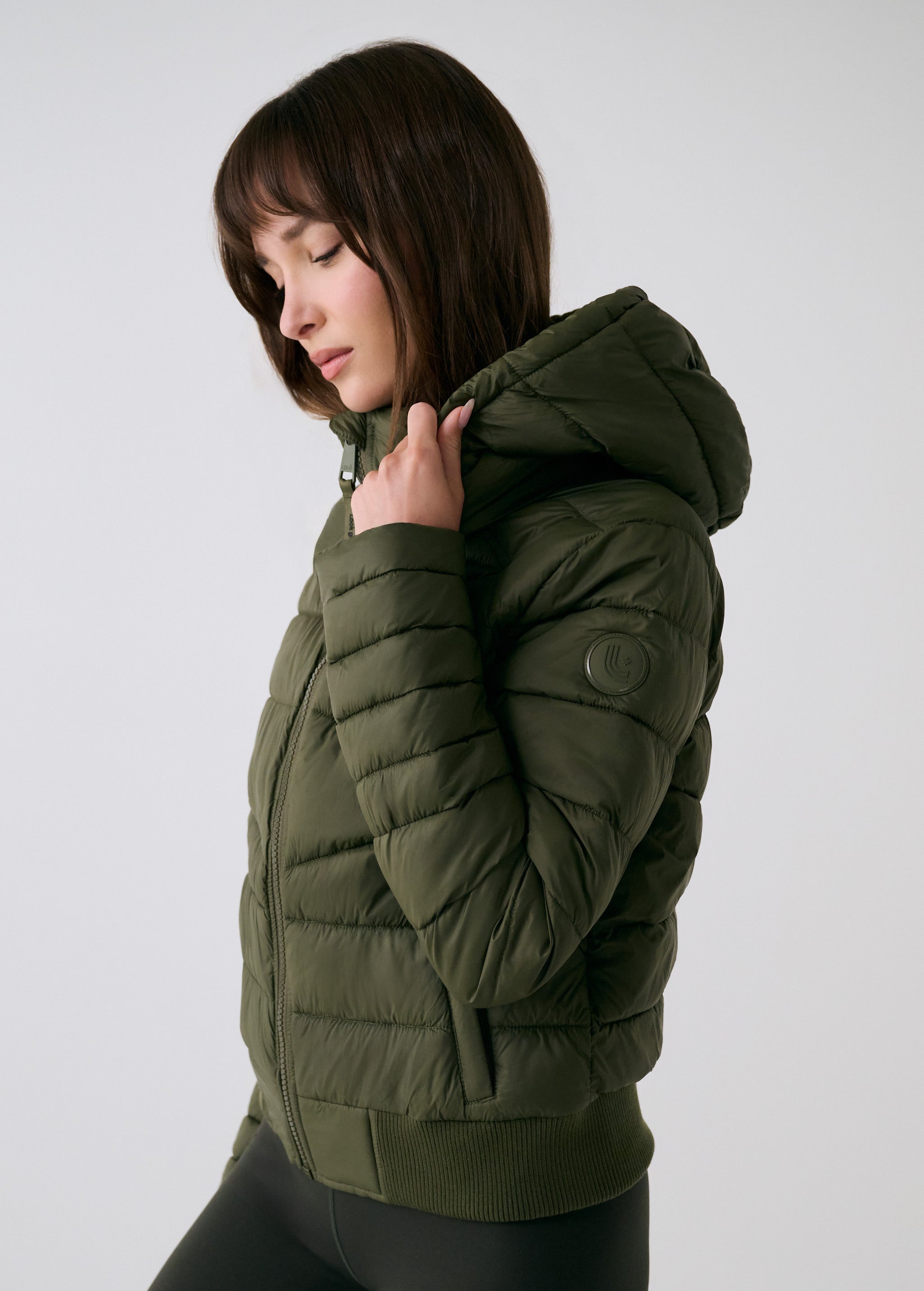 Lolë Eli Synth Down Bomber Jacket in Moss olive green — bonus points for the cropped fit and everyday-ready hues