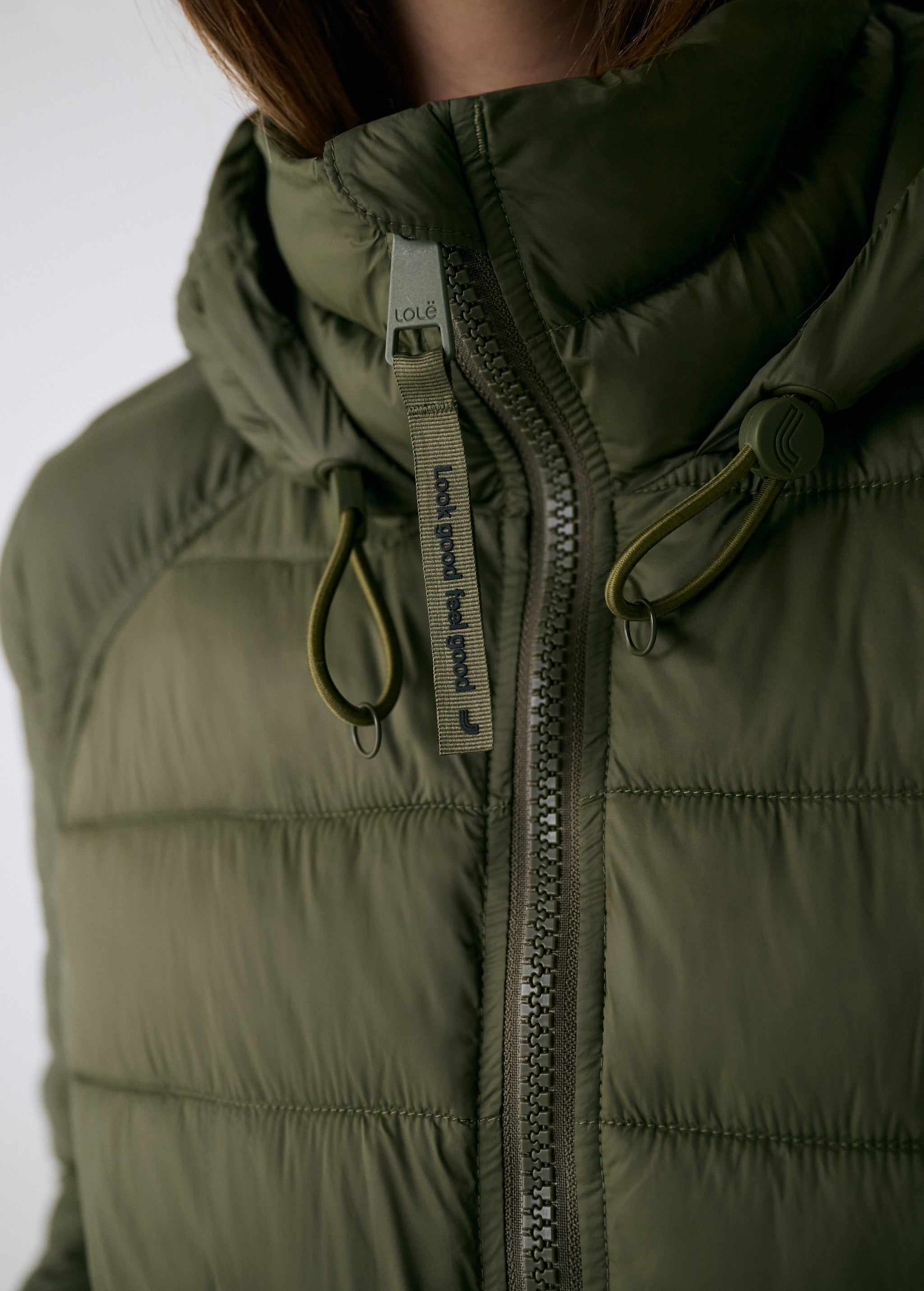 Lolë Eli Synth Down Bomber Jacket in Moss olive green — bonus points for the cropped fit and everyday-ready hues
