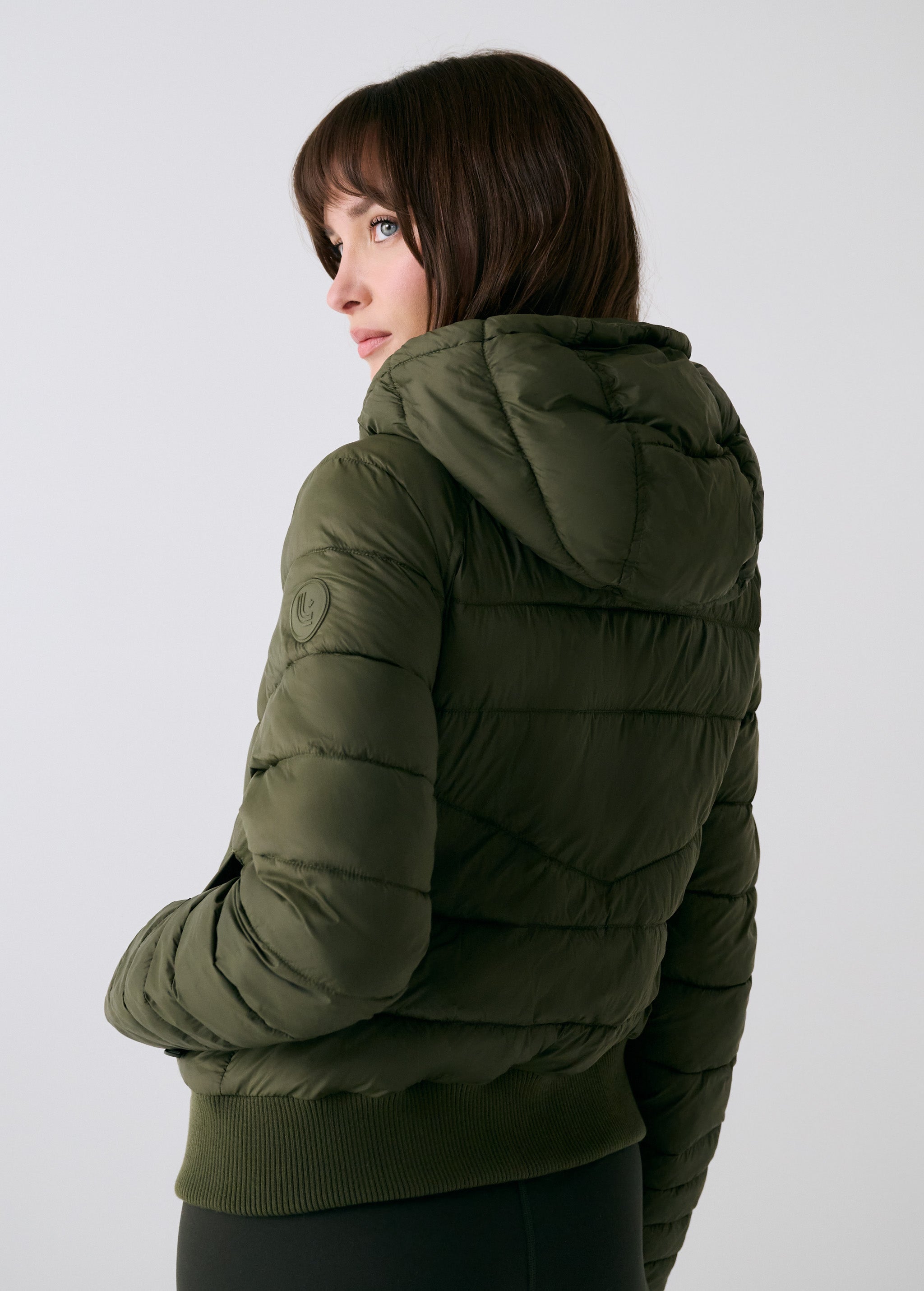 Lolë Eli Synth Down Bomber Jacket in Moss olive green — bonus points for the cropped fit and everyday-ready hues
