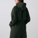 Lolë Piper 2.0 rain jacket in olive green, back view with hood, back yoke and gathered drawcord waist