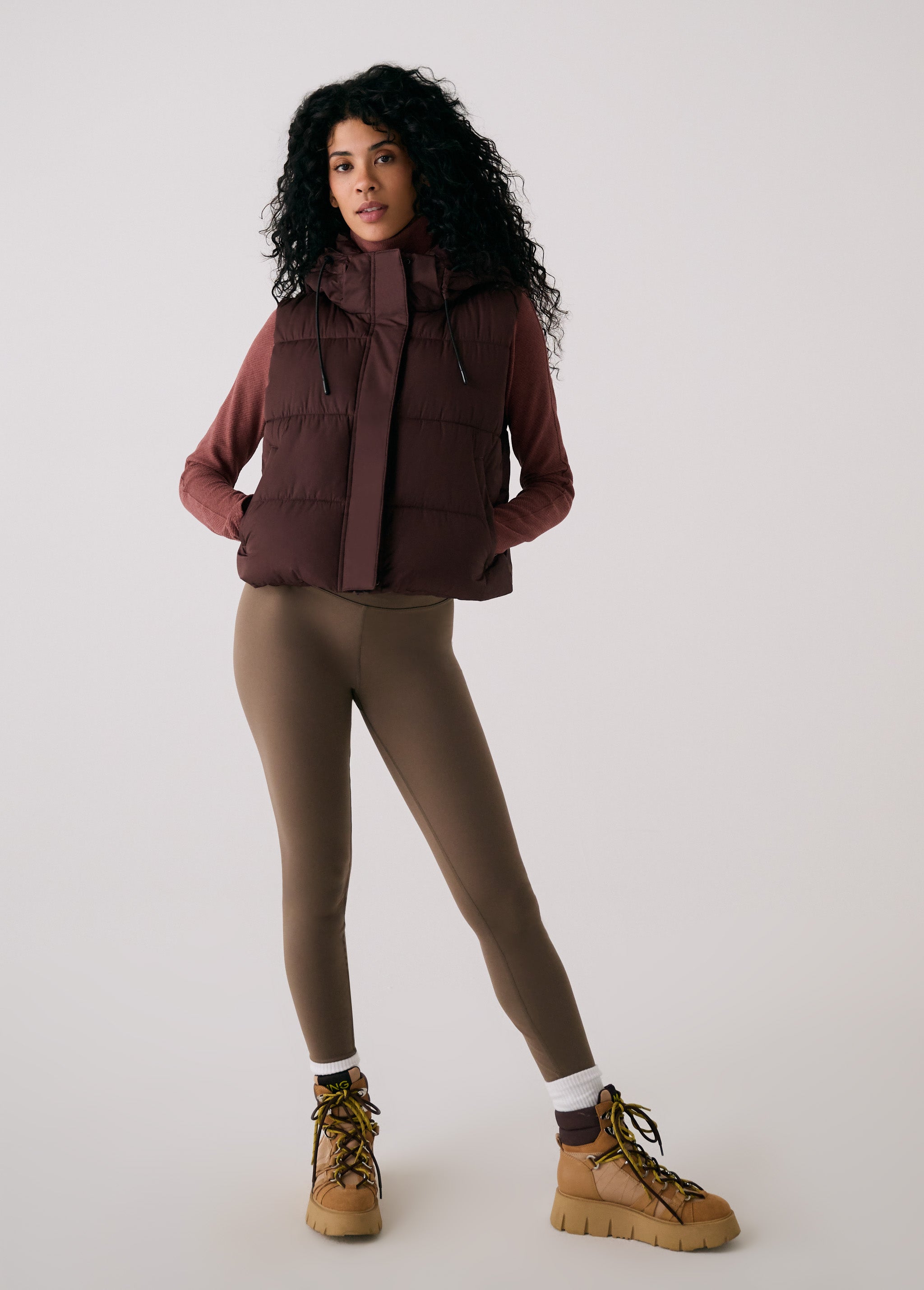 Lolë London Cropped Vest in Java dark brown — wear it over a hoodie or under a coat