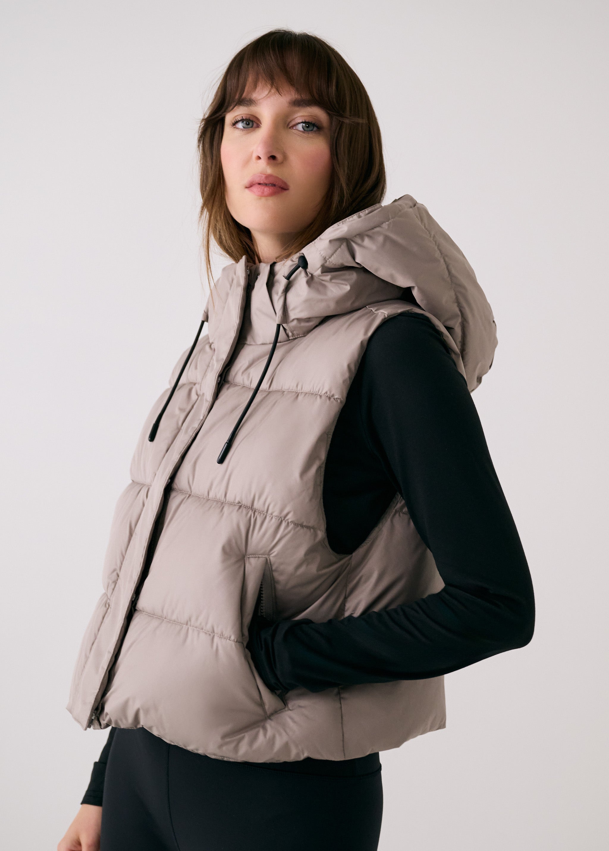 Lolë London Cropped Vest in Pebble taupe — wear it over a hoodie or under a coat