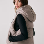 Lolë London Cropped Vest in Pebble taupe — wear it over a hoodie or under a coat