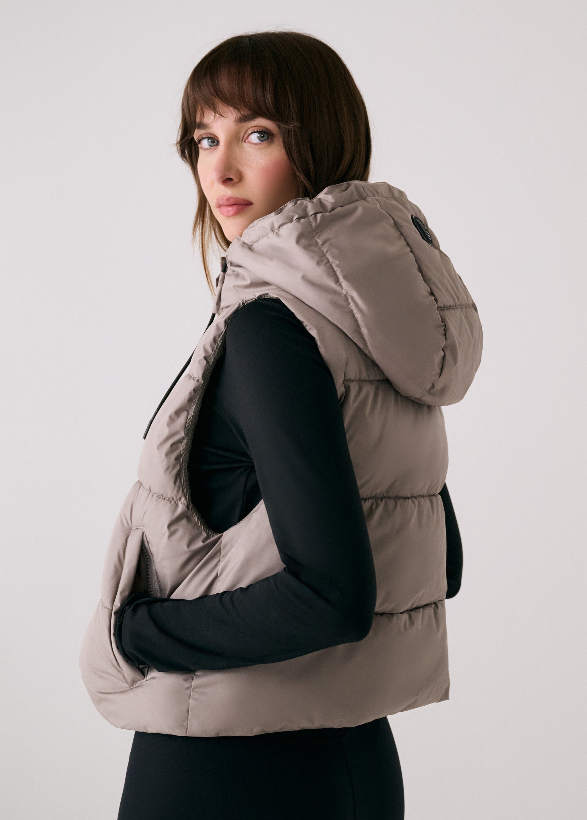 Lolë London Cropped Vest in Pebble taupe — wear it over a hoodie or under a coat