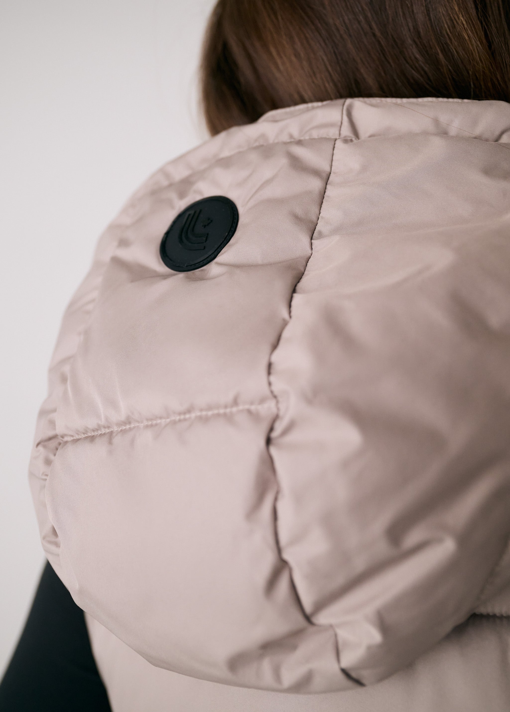 Lolë London Cropped Vest in Pebble taupe — wear it over a hoodie or under a coat