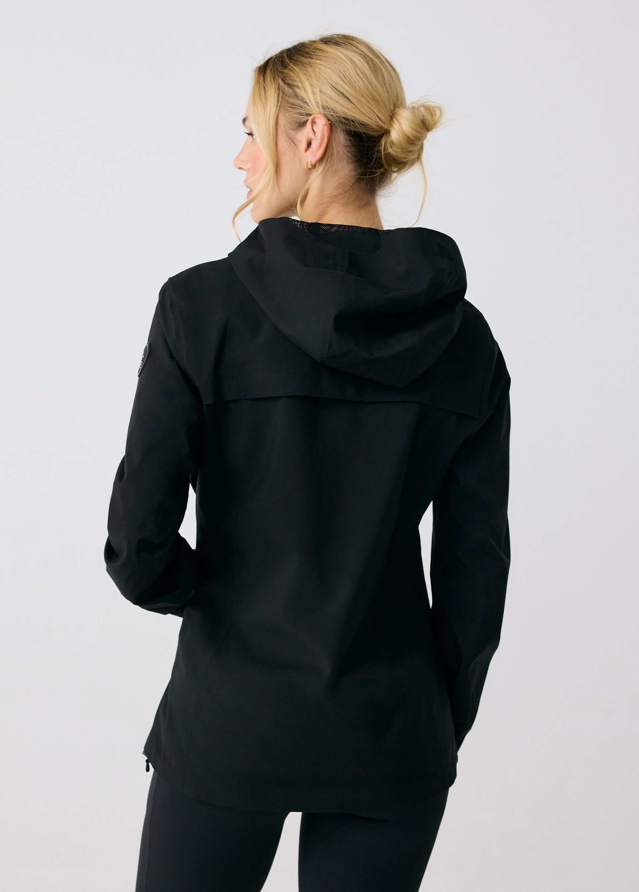 Lolë Element 2 Rain Jacket in black — the Element 2 Rain Jacket is fully seam-sealed to keep moisture out