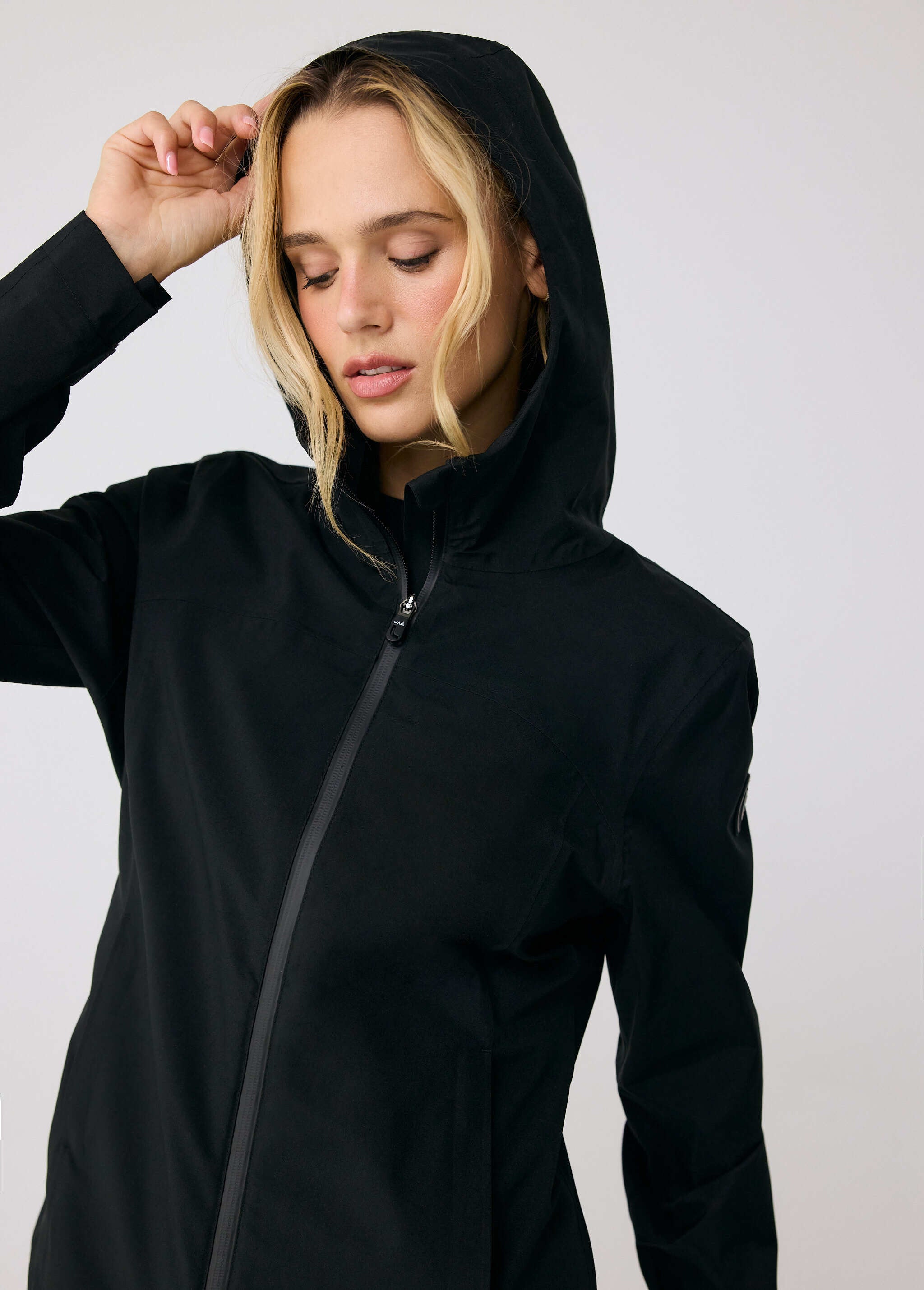 Lolë Element 2 Rain Jacket in black — the Element 2 Rain Jacket is fully seam-sealed to keep moisture out