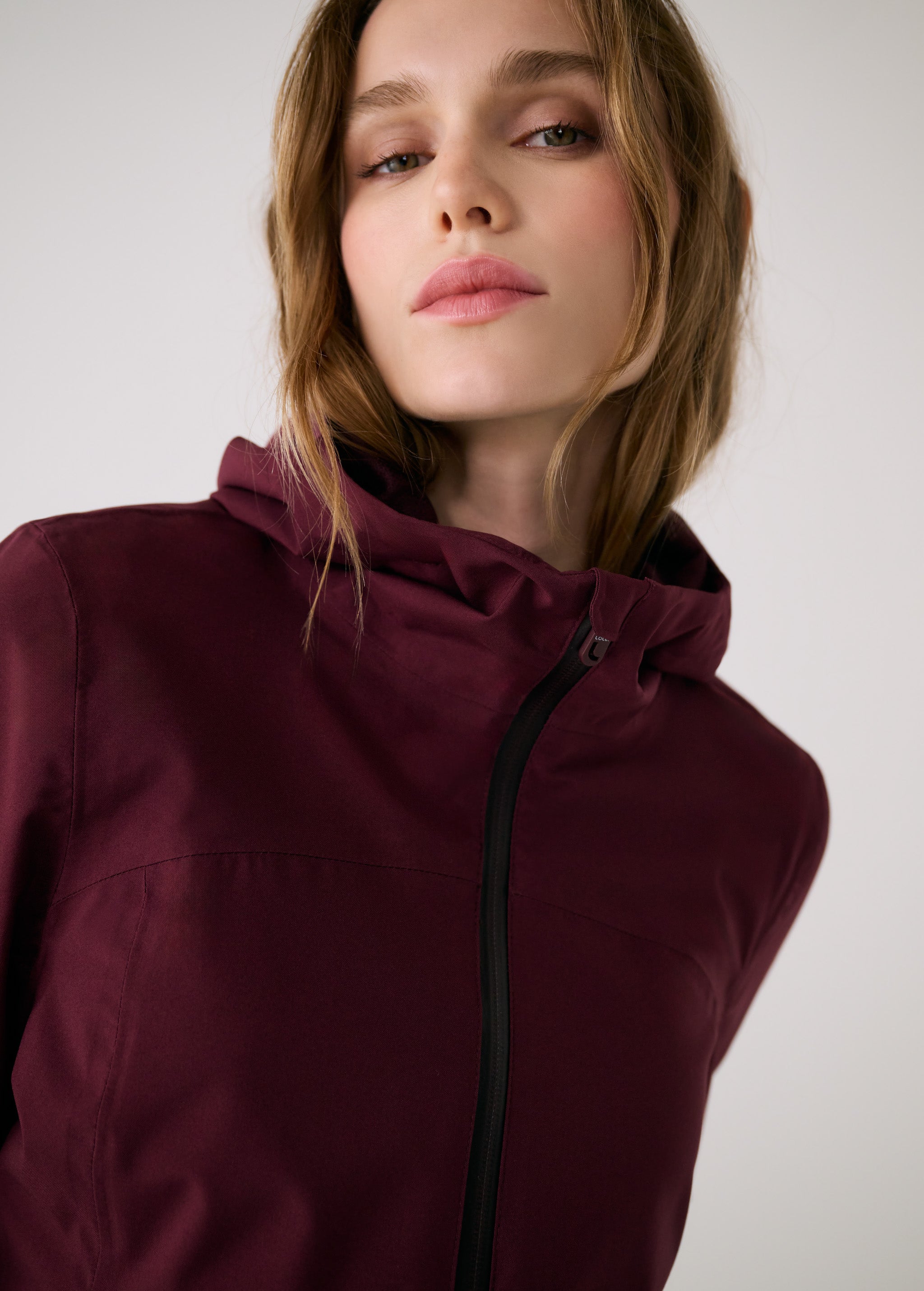 Lolë Element 2 Rain Jacket in burgundy — the Element 2 Rain Jacket is fully seam-sealed to keep moisture out